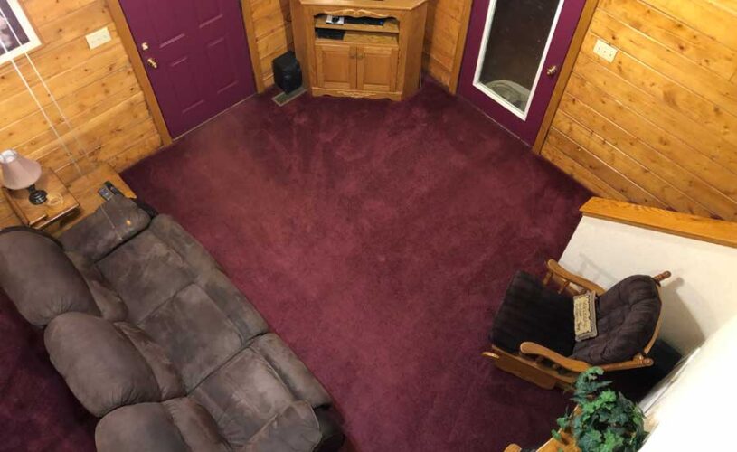 whispering pines cabin living room from above