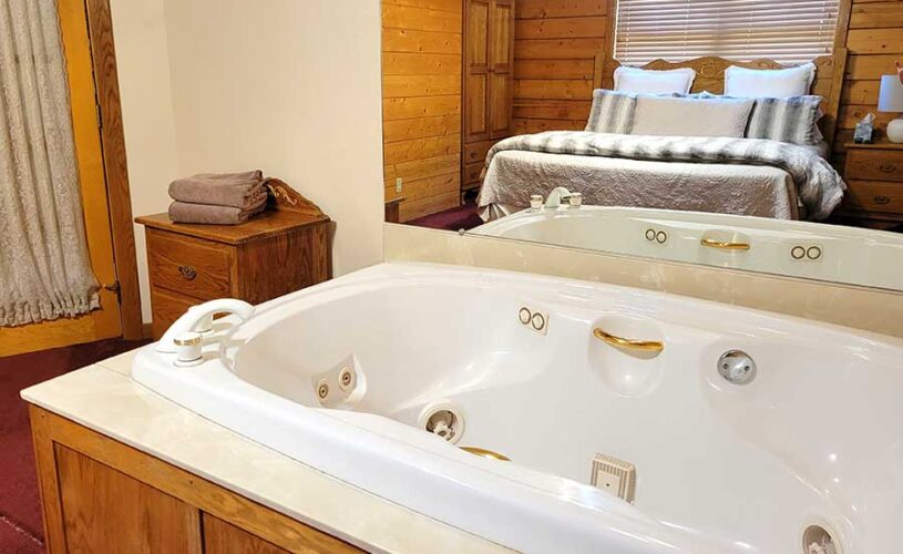 indoor jetted tub in whispering pines cabin